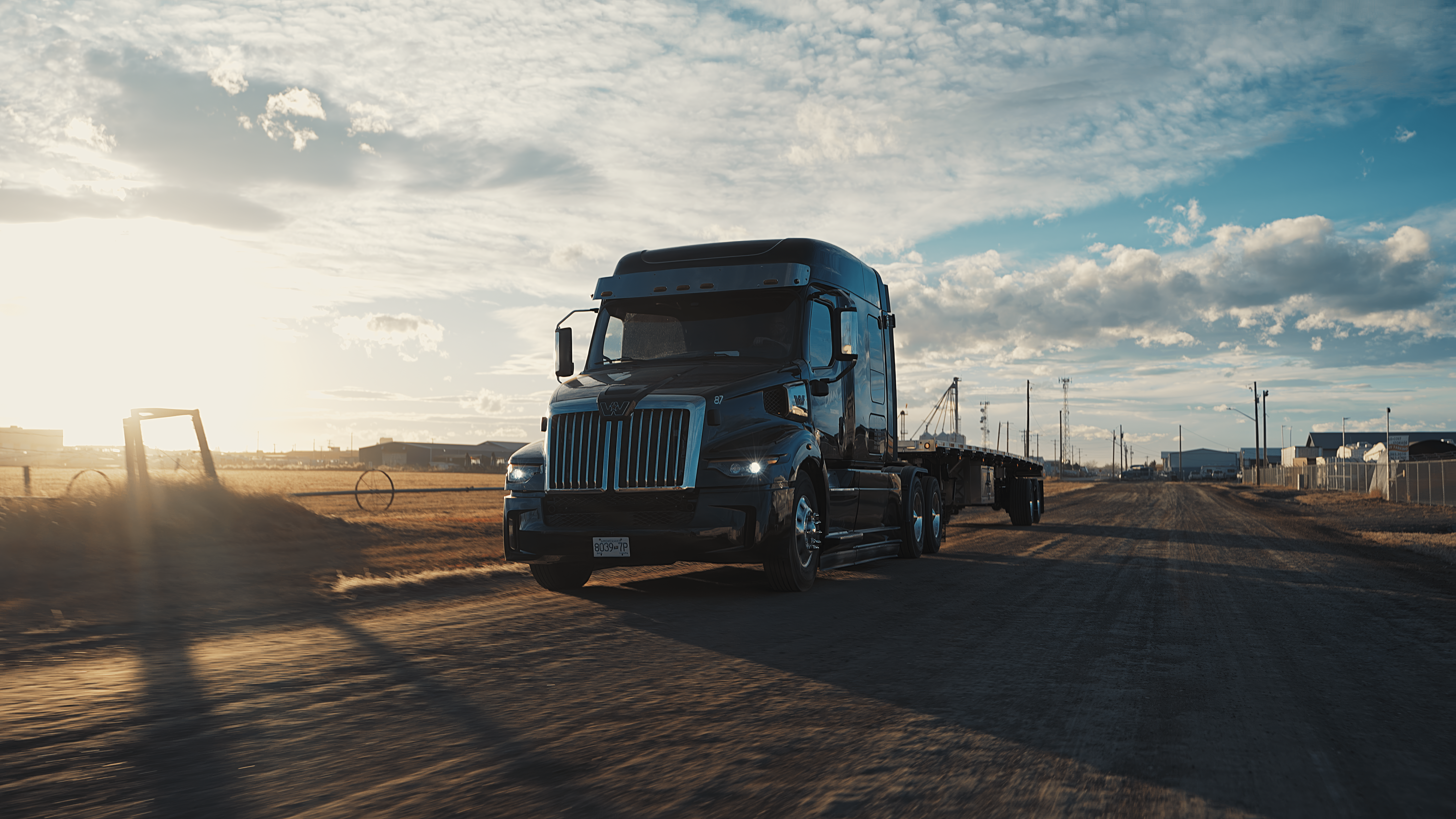 Truck driving in the sunset